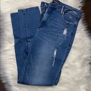 Bebe distressed jeans with silver size 31